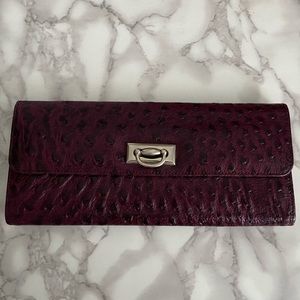 Aubergine ostrich leather clutch